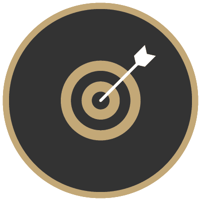 A black and gold target with an arrow in the center.