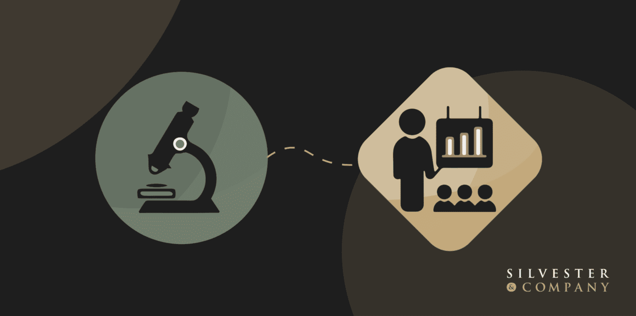 A graphic of a microscope and a person with a sign.