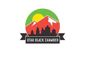 Utah Black Chamber logo with mountains and city.