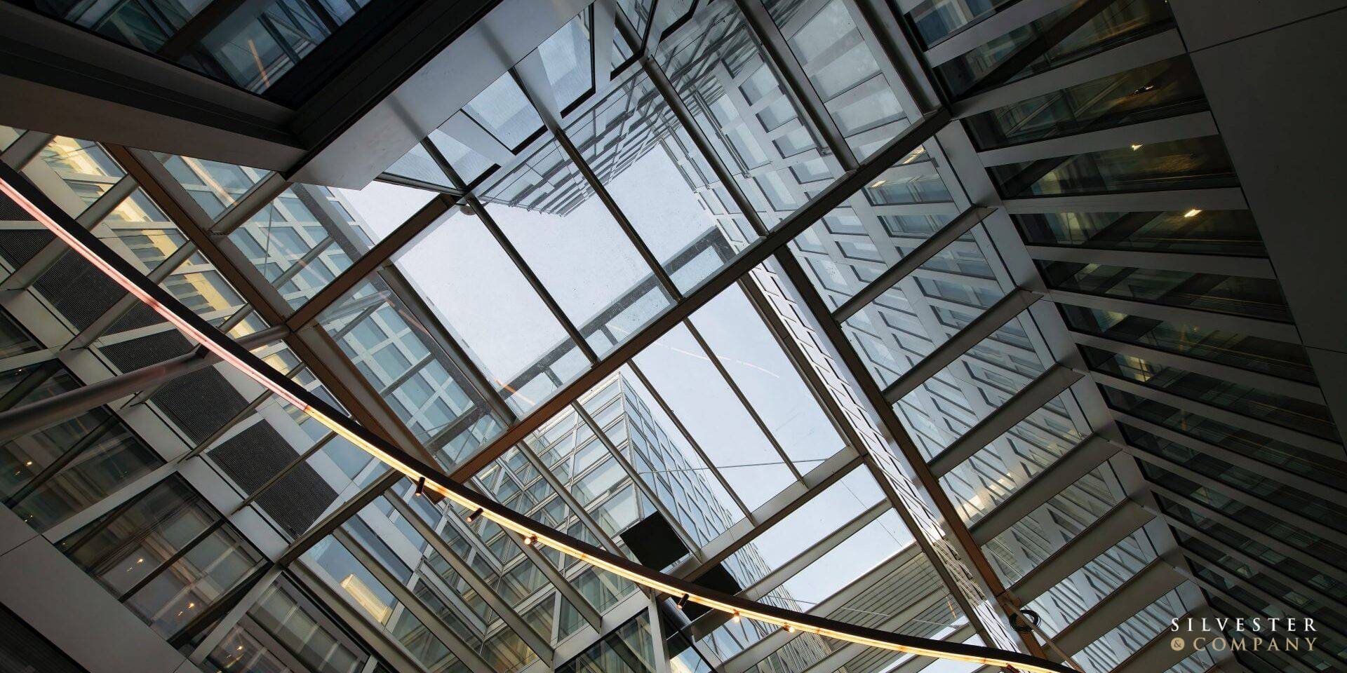 Modern glass and steel building interior.