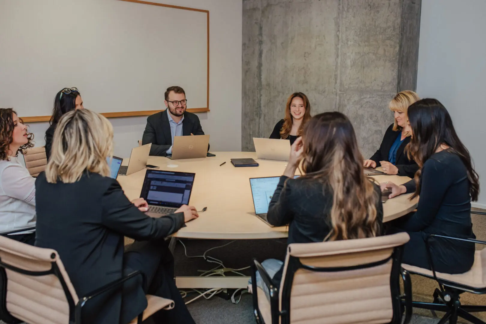 Business meeting with laptops and people.