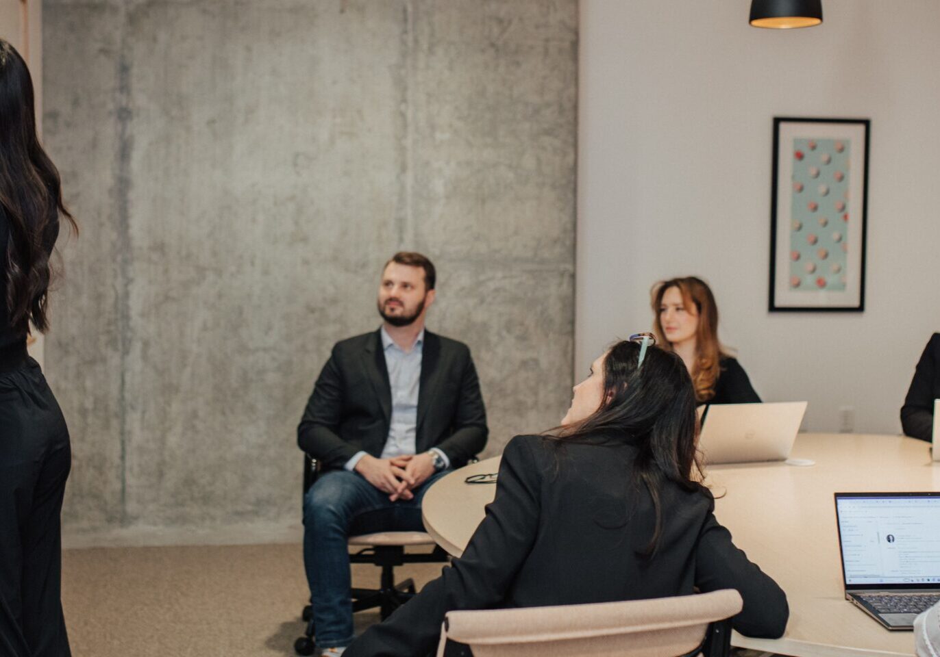 Business meeting with woman presenting.