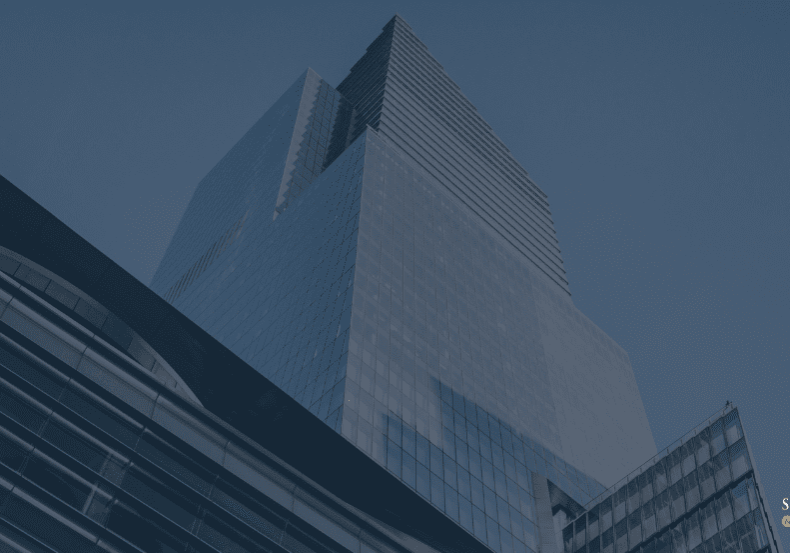 Modern office building with blue sky.