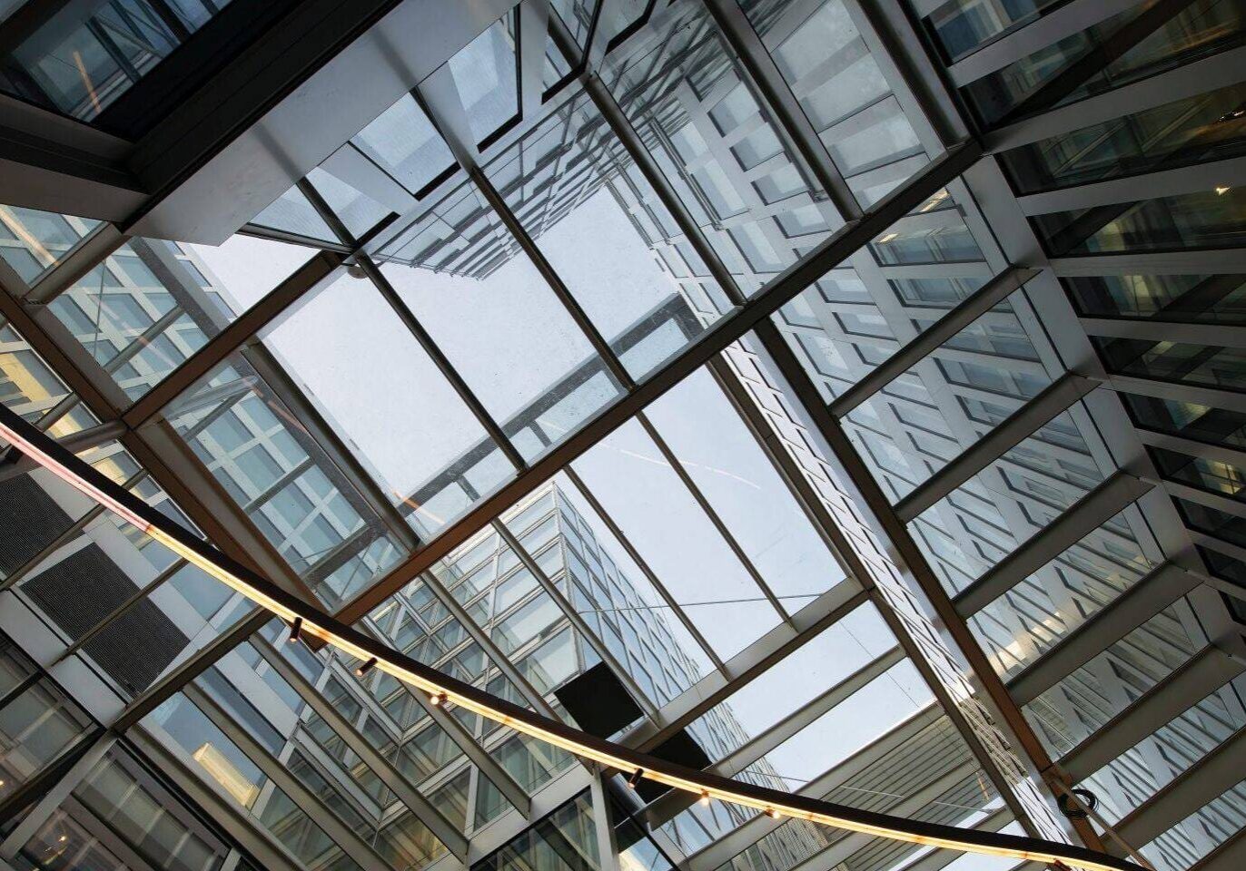 Modern glass and steel building interior.